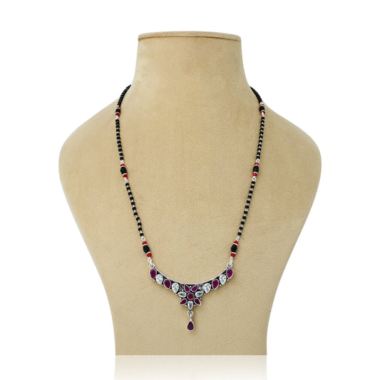 Sterling silver mangalsutra featuring a maroon gemstone and intricate flower design