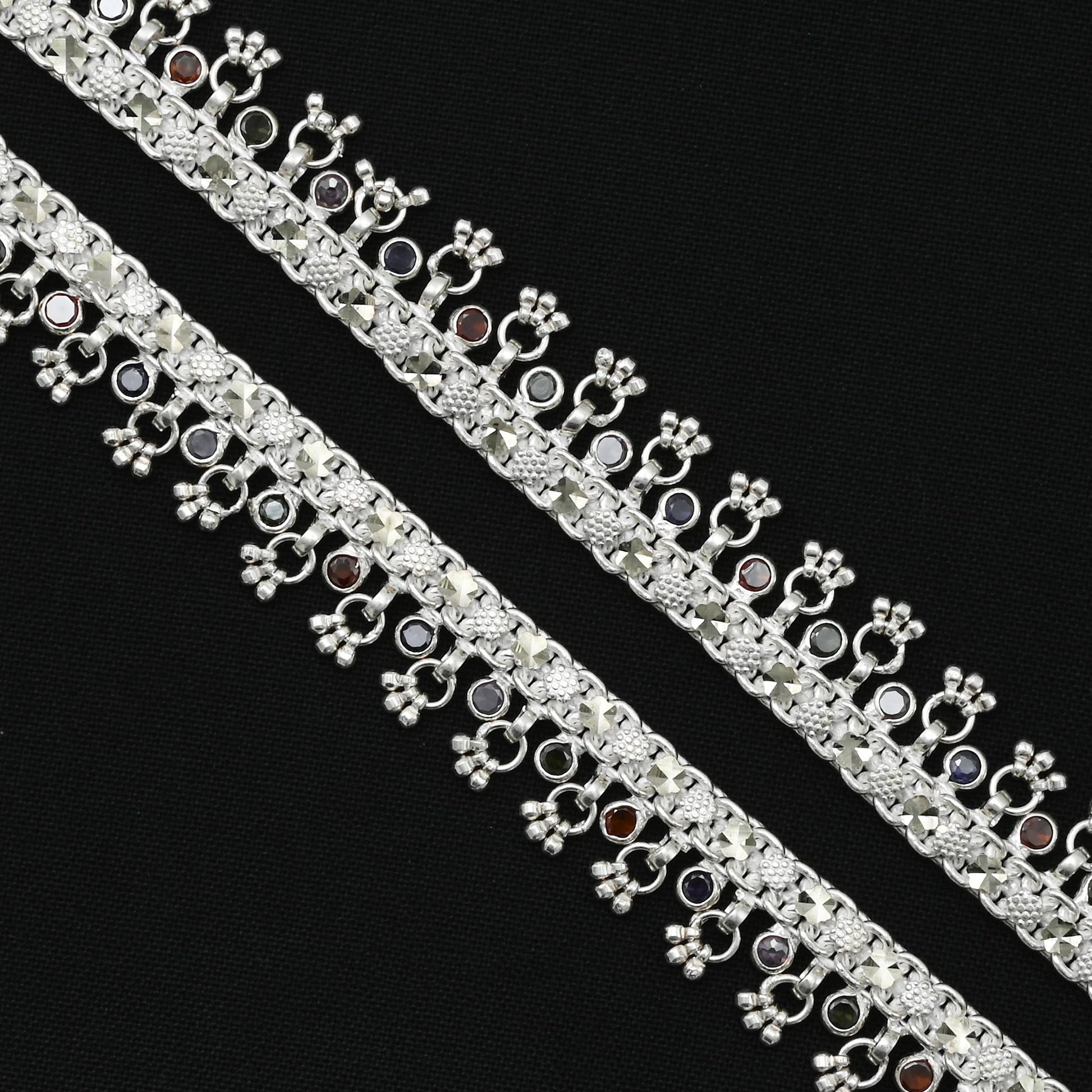 Silver bridal anklet with an array of gems, adding a touch of glory