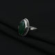 Stylish silver ring showcasing a beautifully cut green stone, combining luxury and sophistication