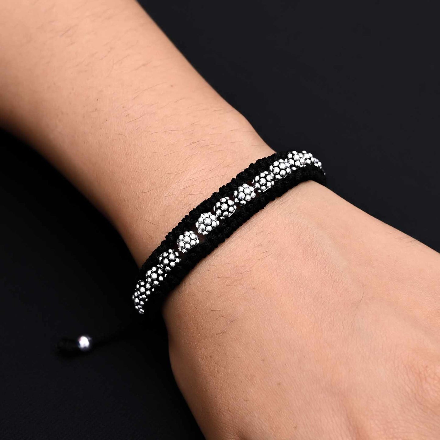 Elegant silver bracelet featuring round silver beads with dotted detailing