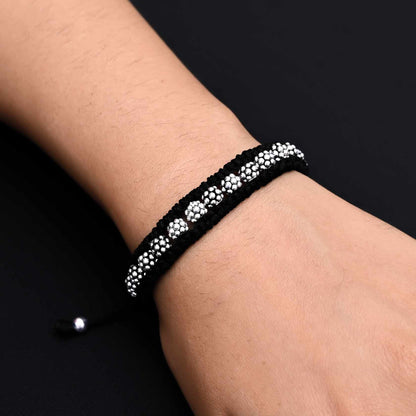 Elegant silver bracelet featuring round silver beads with dotted detailing