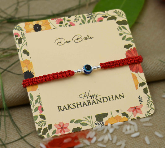 Silver center Evil Eye design with silver beads, perfect Rakhi for boys.