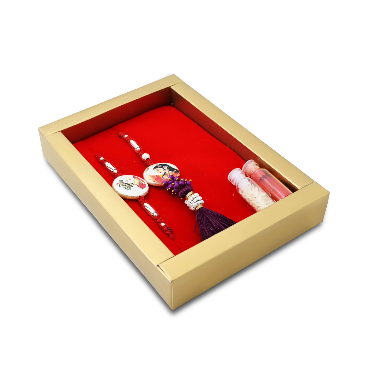 Silver Raja Rani Rakhi with a maroon theme, kumkum, and rice, perfect for boys.