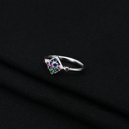 Elegant silver ring showcasing beautiful green and pink stones, ideal for a chic and playful look