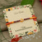 Silver Center Yellow Flower with Silver and Light Red Beads Rakhi for Boys