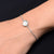 Elegant sterling silver bracelet with a delicate fish design and pearl accents for girls