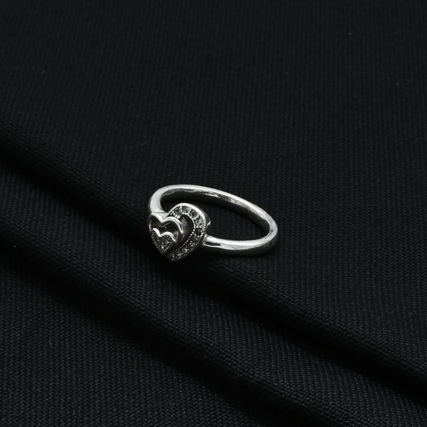 Stylish silver ring showcasing a prominent heart design, ideal for girls who love statement pieces.