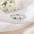 Sterling Silver Ring Featuring Alternating Green and White Stones