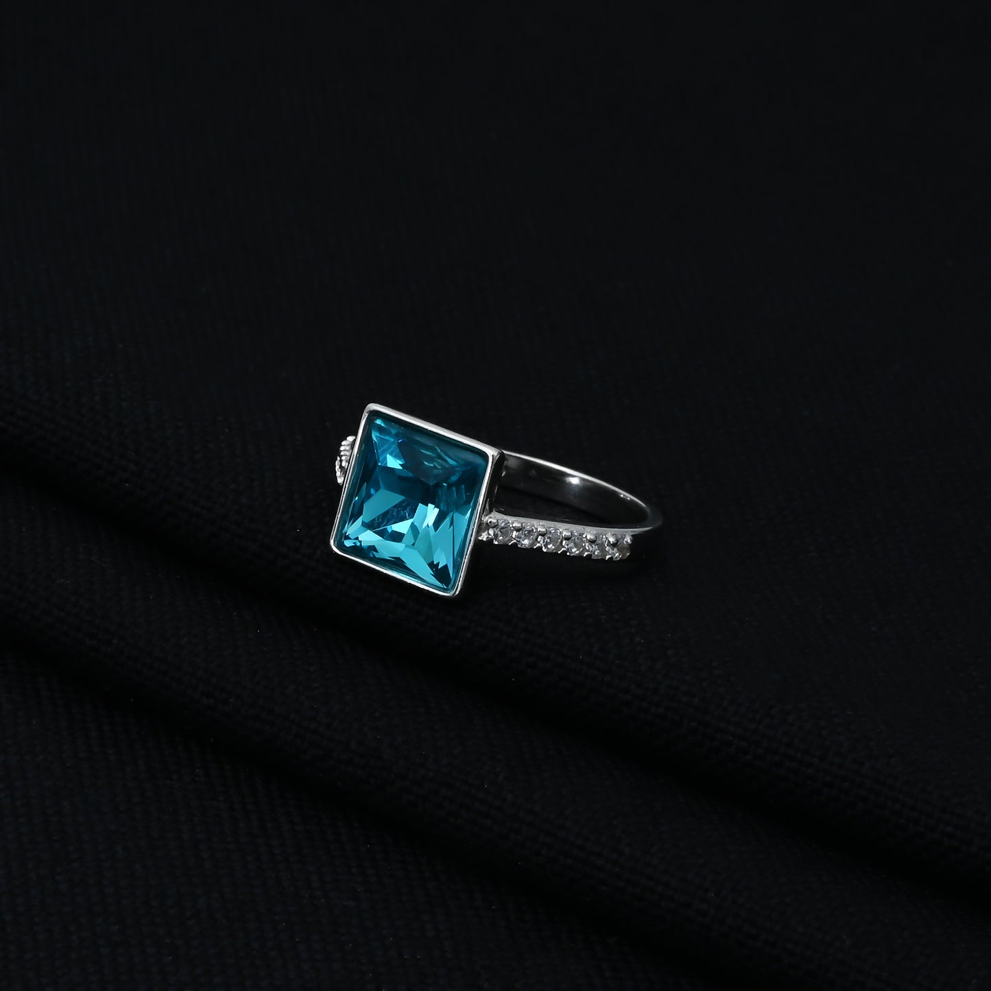 Charming sterling silver ring with a beautiful square-cut sky-blue gemstone for women.