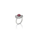 Elegant silver ring featuring heart-shaped red gem.