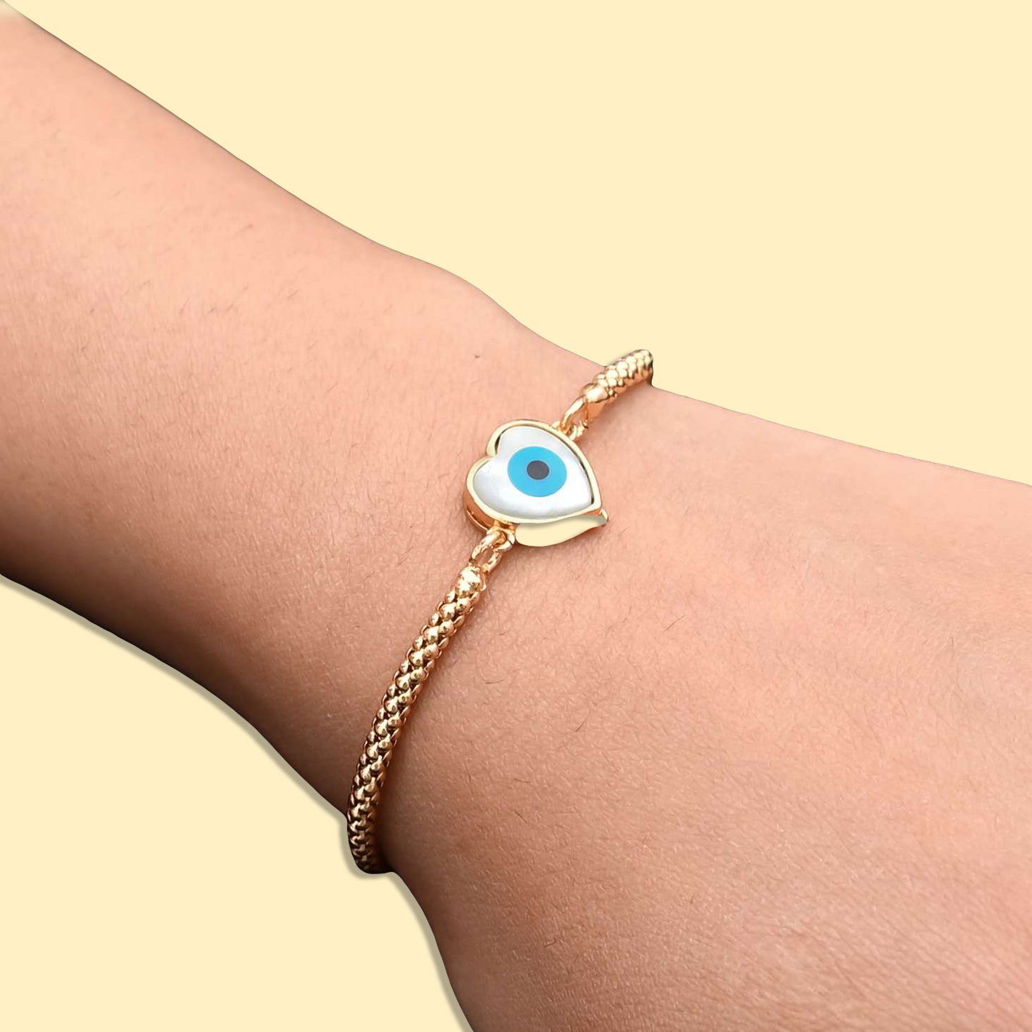 Stylish sterling silver bracelet for girls showcasing a charming evil eye and heart motif