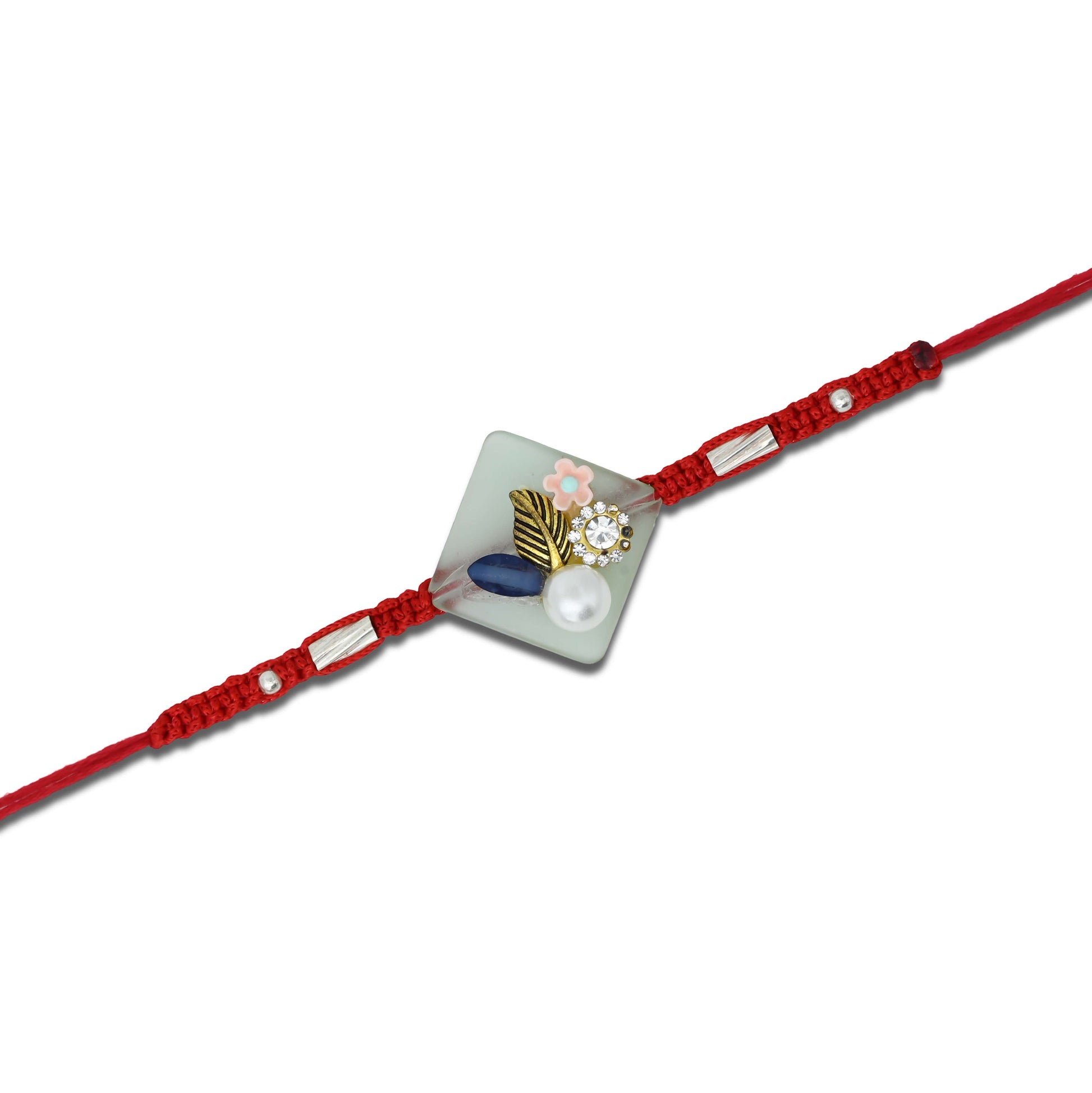 Boys' Rakhi featuring a silver flower design with pearl accents.