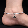 Silver traditional charm kada payal, featuring intricate designs for a classic look.
