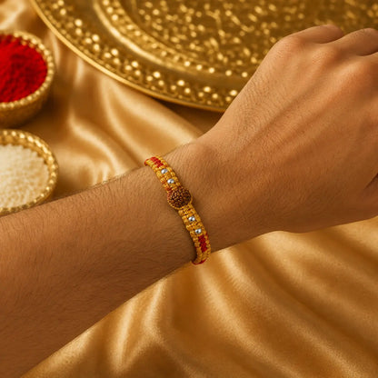 Traditional red Rudraksha Rakhi with natural Rudraksha beads and silver-tone beads