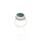 Close-up of a silver ring with a beautiful green gemstone, offering a timeless accessory for her