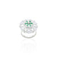 Close-up of a silver ring adorned with vibrant green and sparkling white stones, perfect for a sophisticated look.