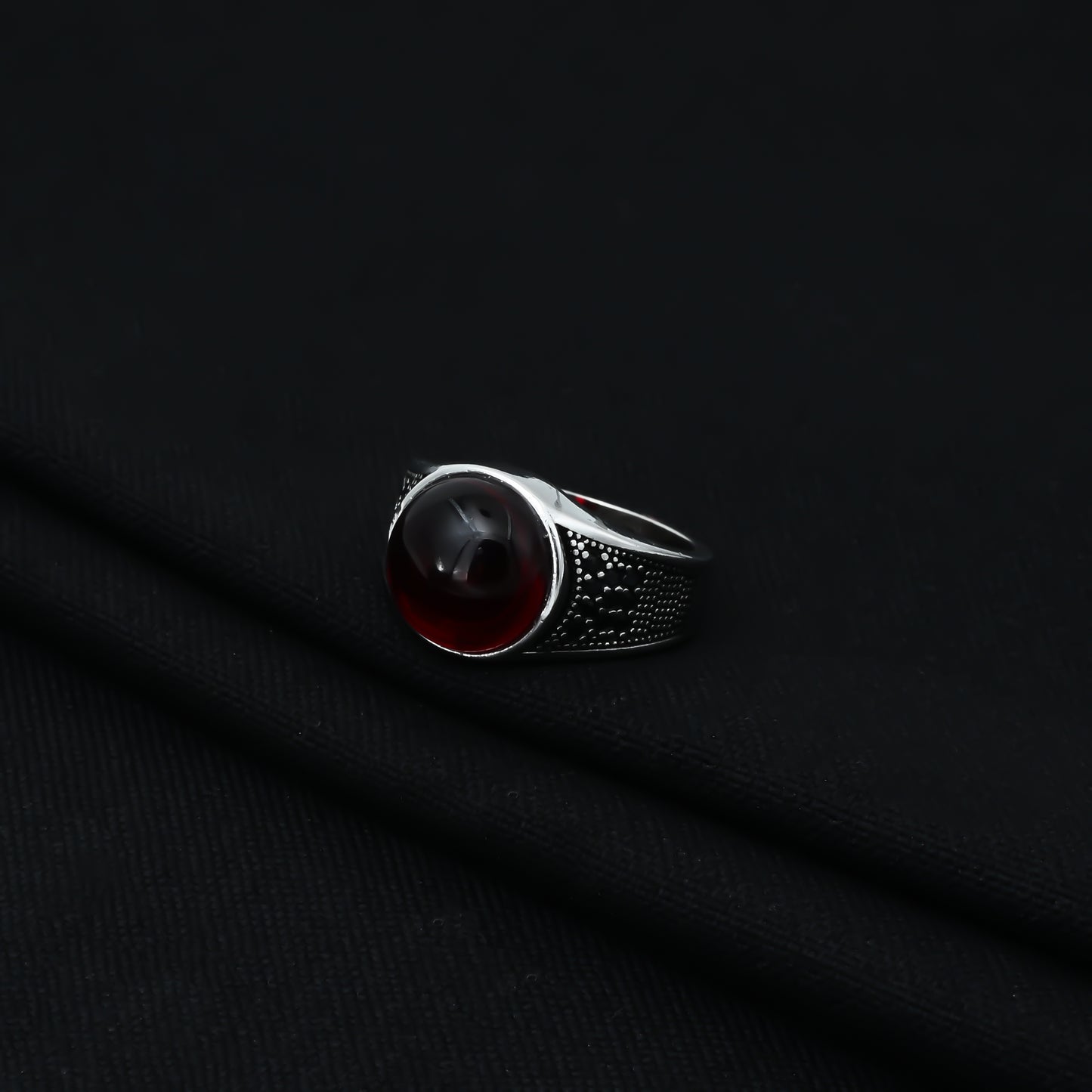 Charming sterling silver ring with a deep red 'Blood Moon' gemstone, crafted for boys