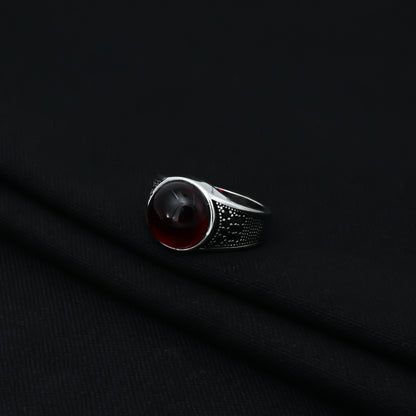 Charming sterling silver ring with a deep red 'Blood Moon' gemstone, crafted for boys