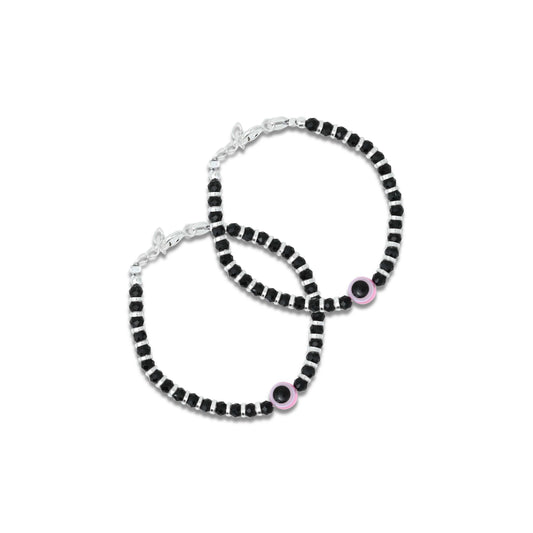 Baby silver bracelet featuring a pink evil eye charm with black and silver beads