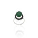 Close-up of a silver ring for girls with a beautiful green gemstone, perfect for adding a fresh pop of color.