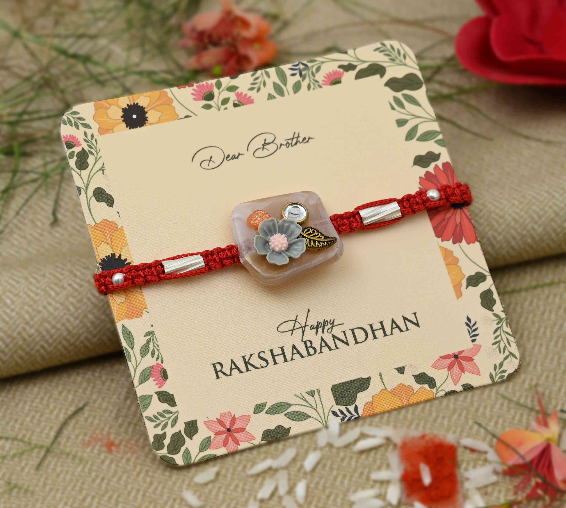 Silver grey flower design with leaf accents, perfect Rakhi for boys