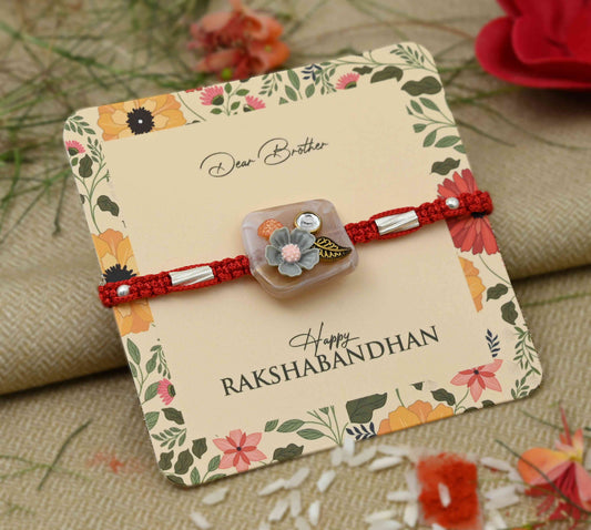 Silver grey flower design with leaf accents, perfect Rakhi for boys