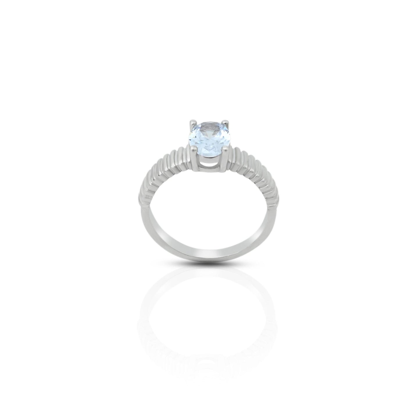 Close-up of a 925 silver ring with an elegant oval cut aquamarine crystal for girls