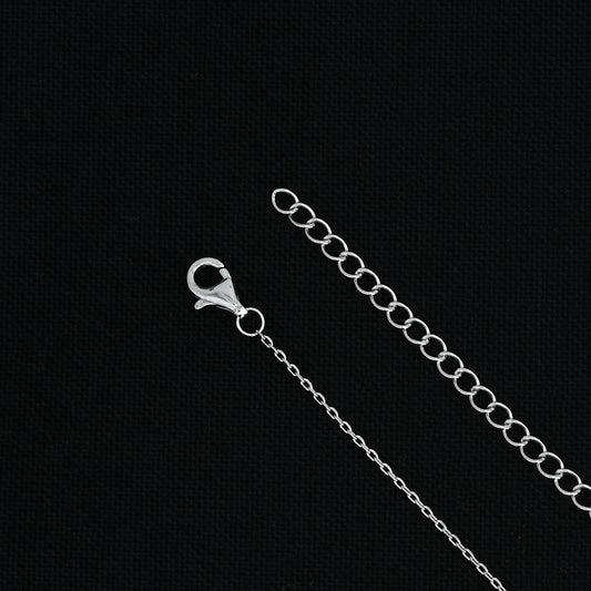 Silver chain with custom 'N' symbol pendant.